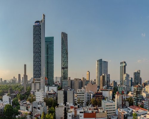 Exterior view of modern office buildings along Insurgentes Avenue in Mexico City