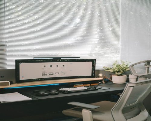Ergonomic desk setup with an external monitor and natural daylight